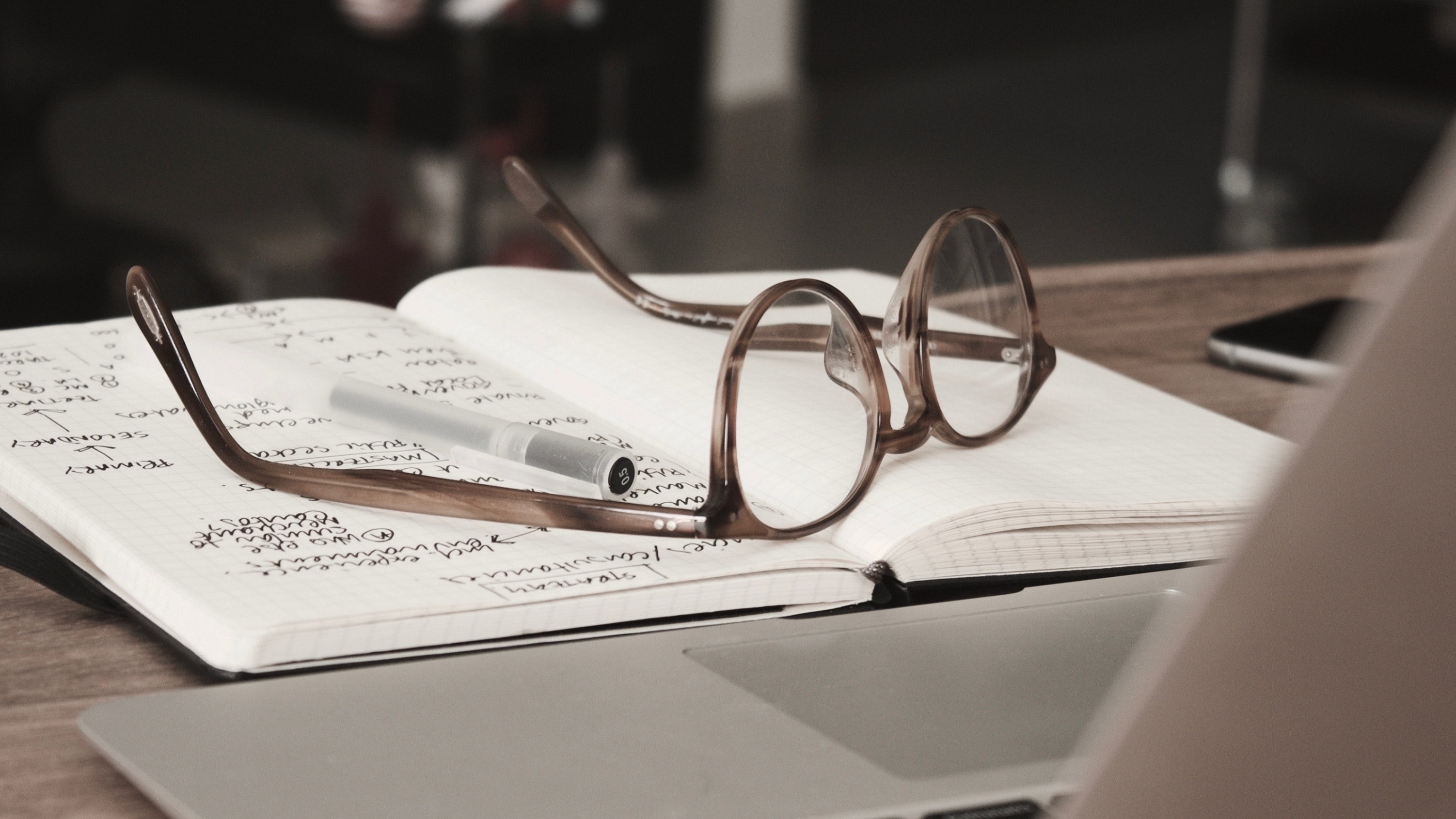 open book with glasses on top